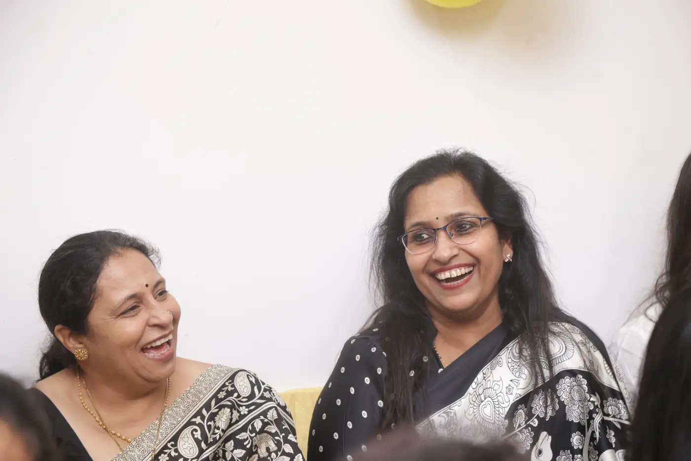 Two women sharing a happy laugh