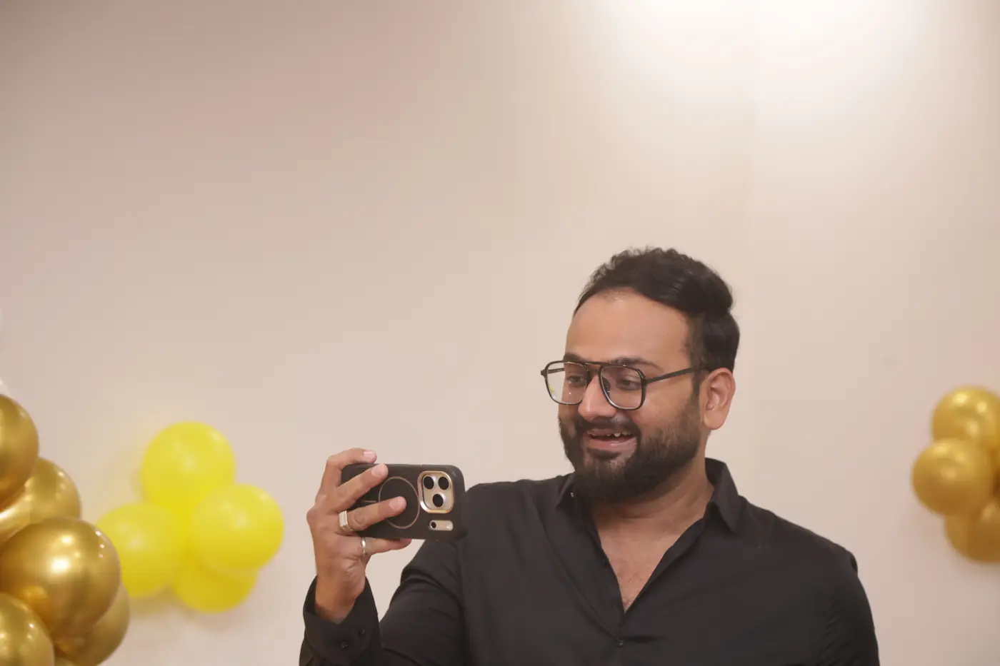 A guest taking a photograph on his phone
