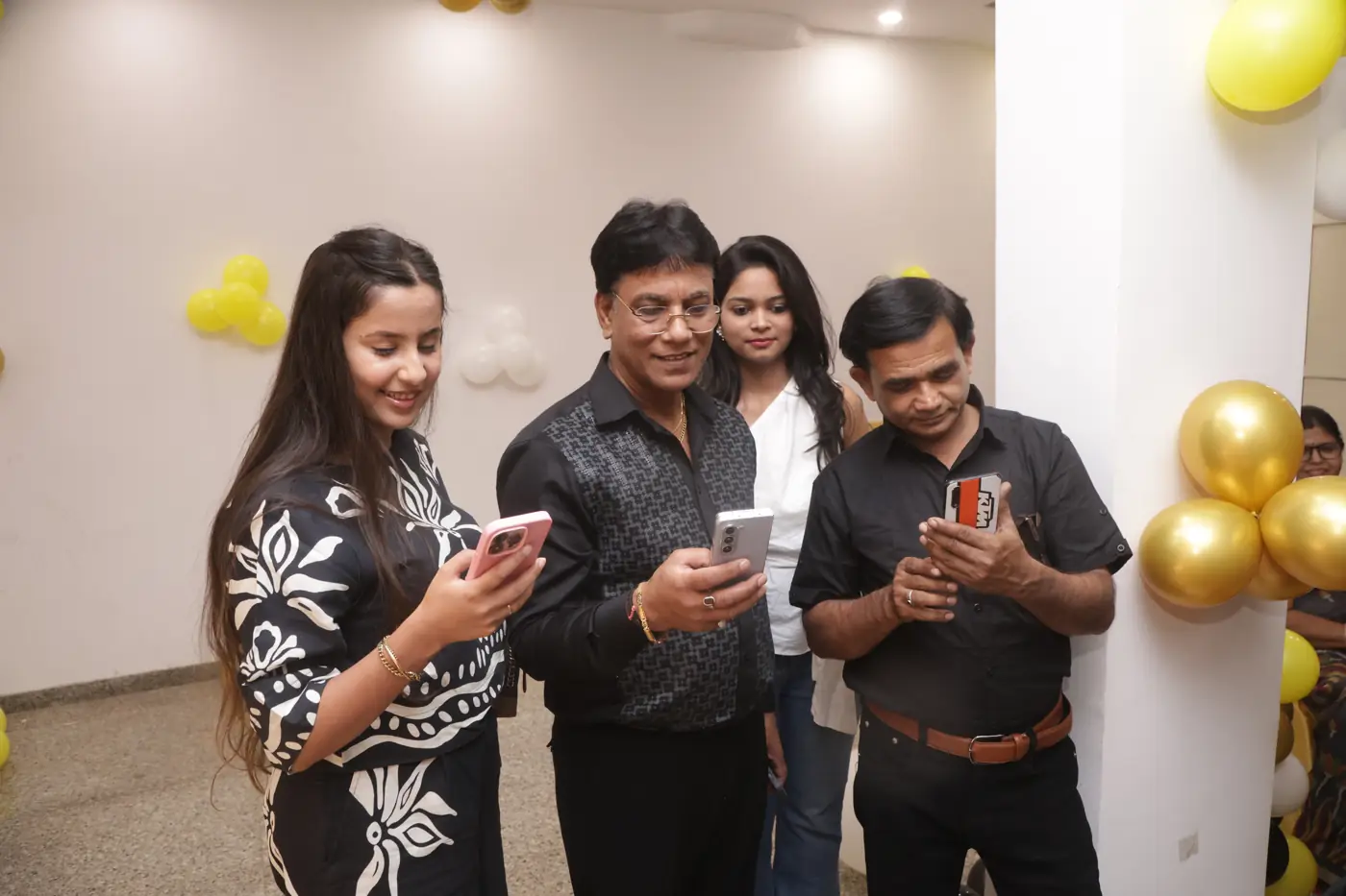 Guests looking at photographs together on their phones