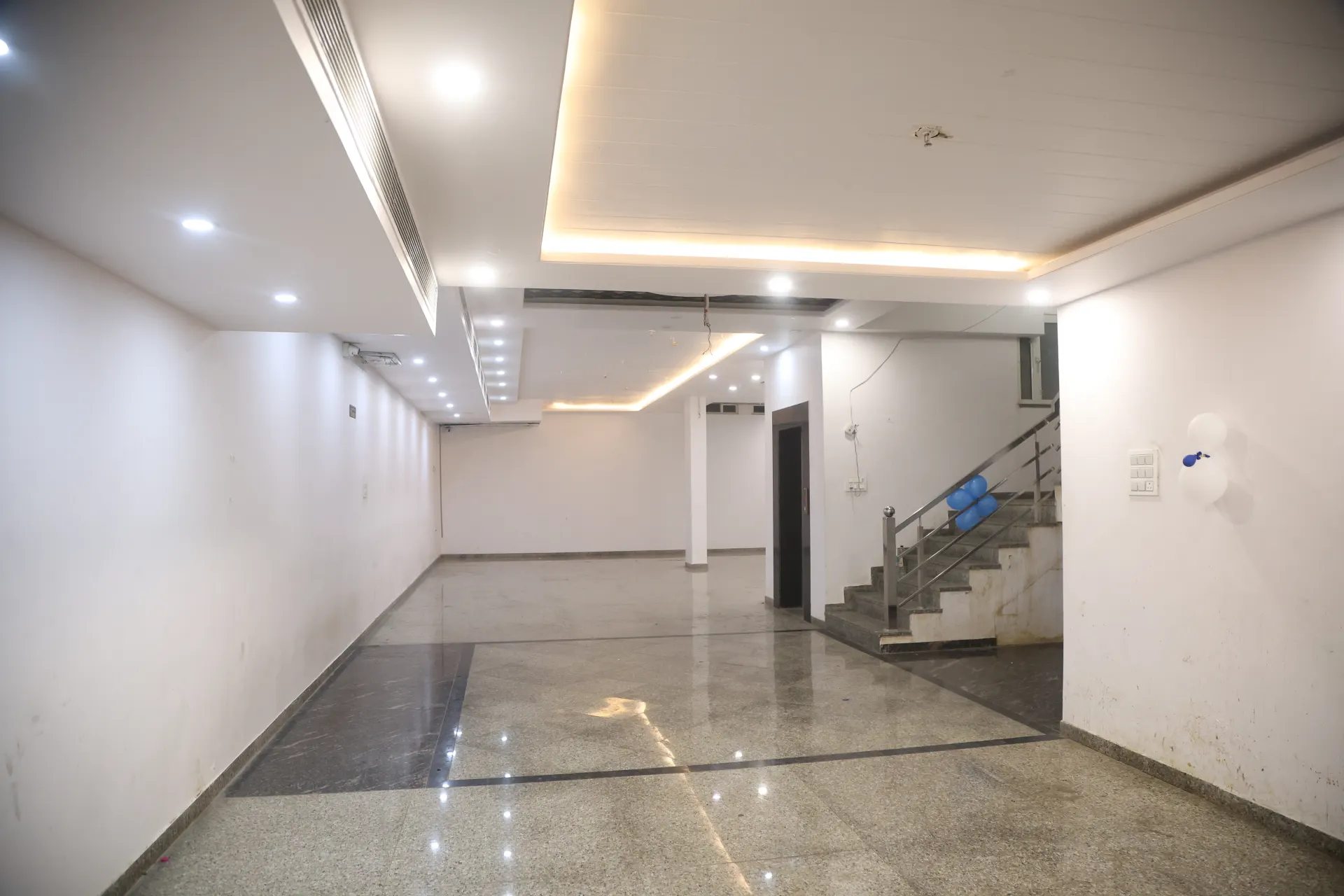 Banquet hall seen near a staircase