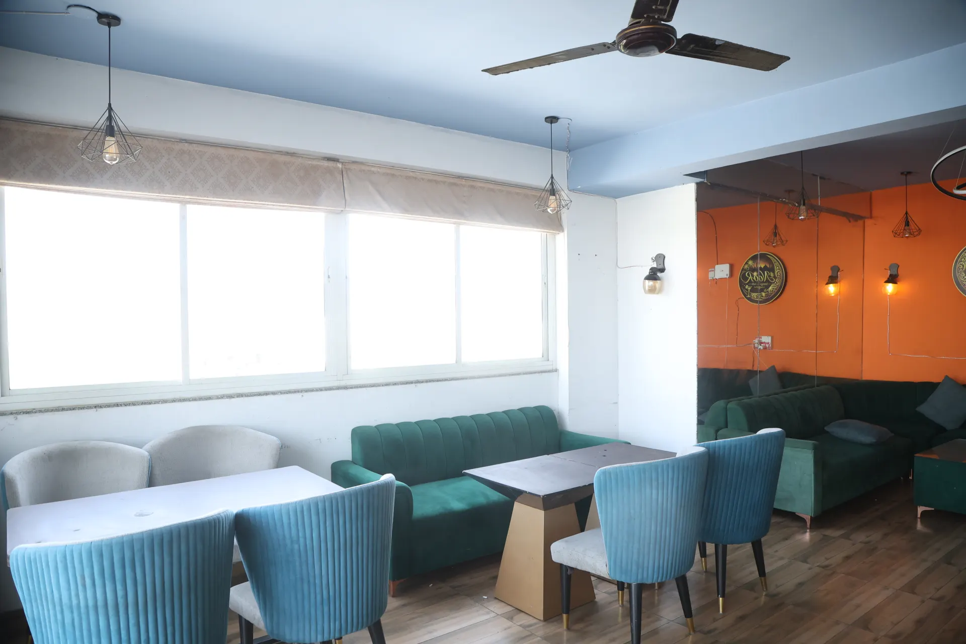 Rooftop lounge in daylight with big windows