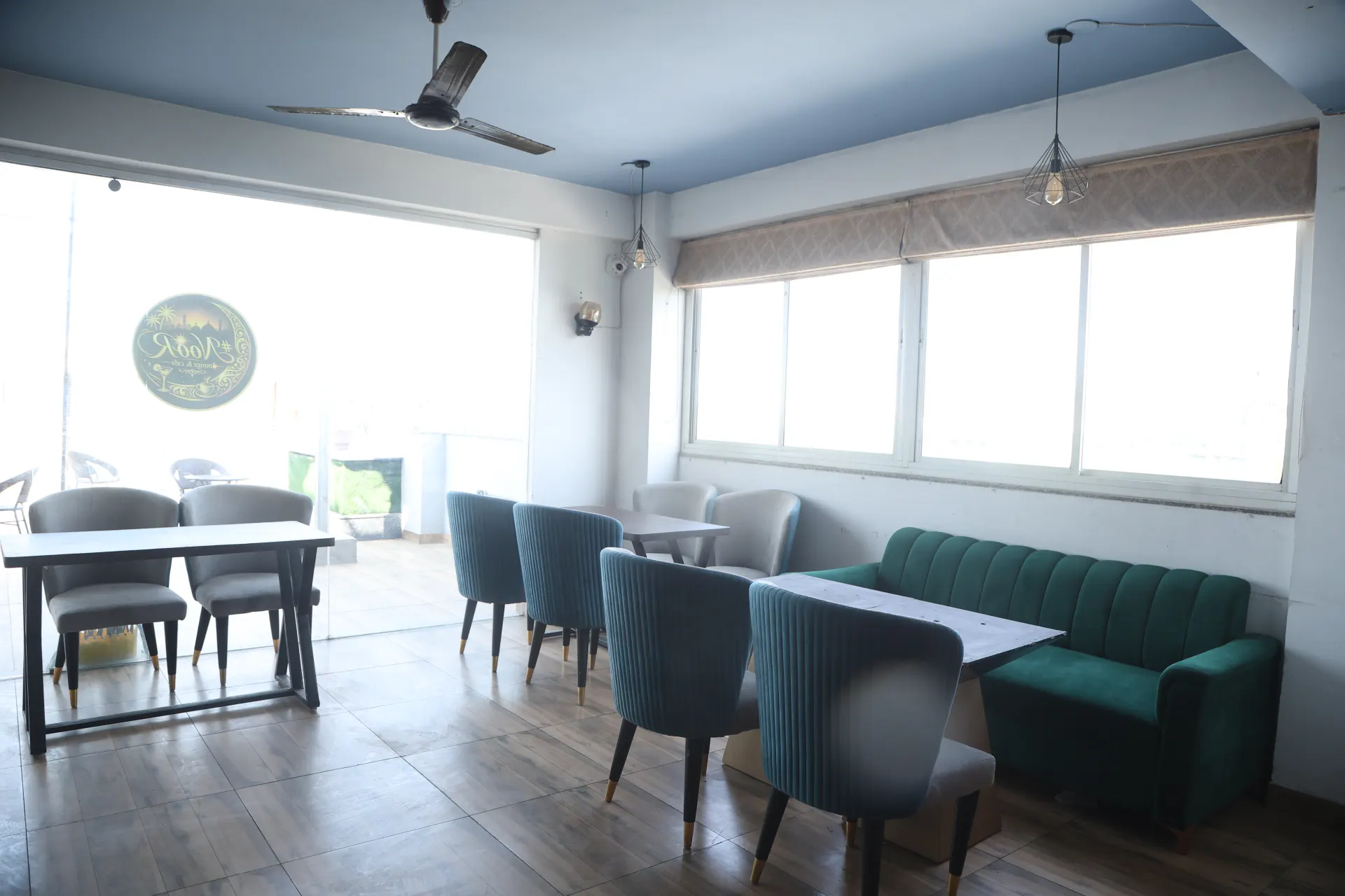 Rooftop dining tables by big windows
