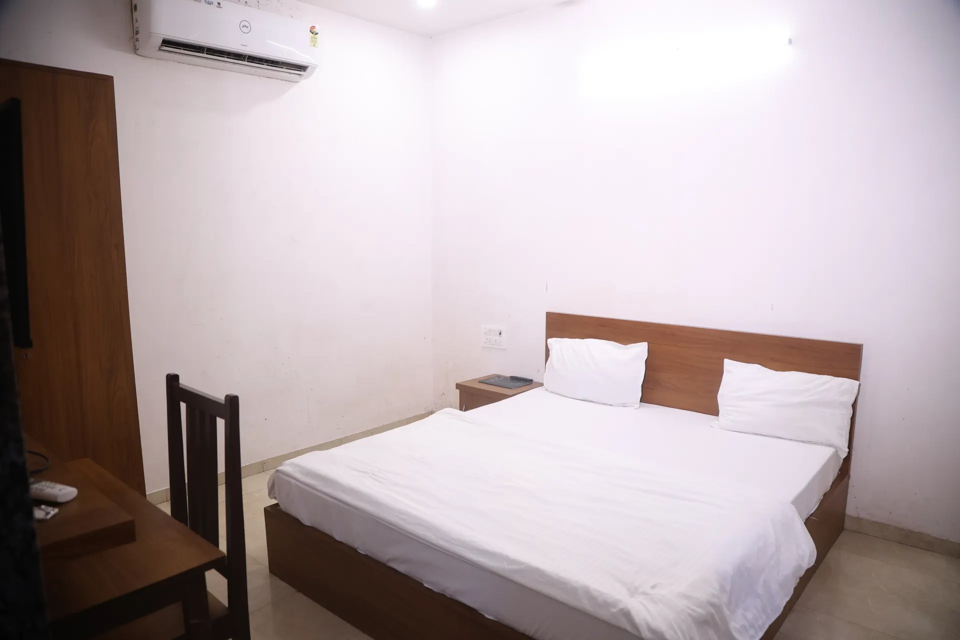 Guest room with white bedding and a comfortable interior