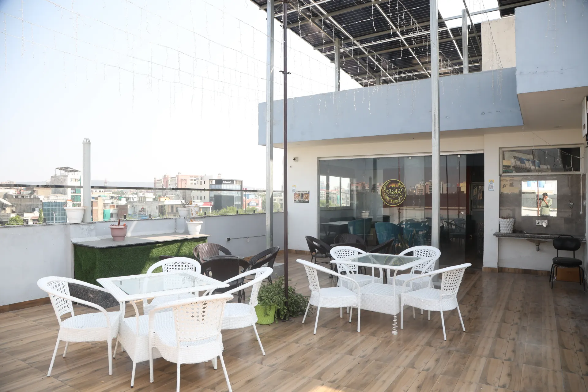 Open terrace with white chairs