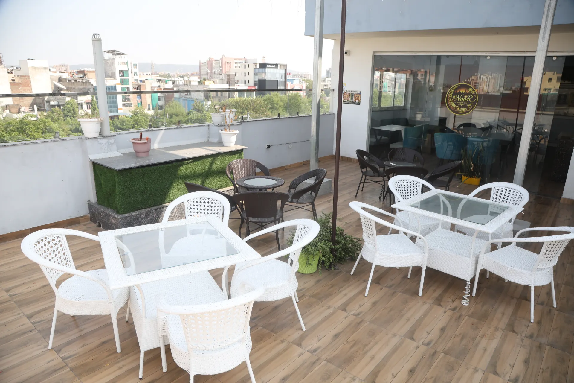 White chairs arranged on the open terrace